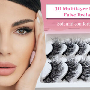 Tray of black false eyelashes beside a model wearing eye makeup.