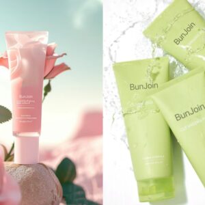 Pink and green BunJoin facial cleanser tubes with flowers and water splashes.