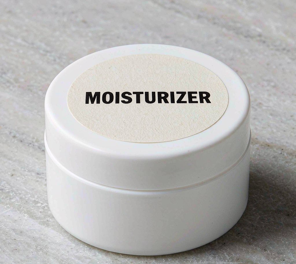 Moisturizer jar with product label in men's grooming range